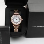 First Copy Emporio Armani Rose Gold White Dial Roman Marker Diamond Bezel Women’s Analog Watch
